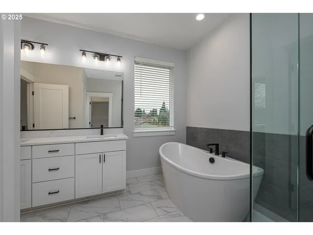 a bathroom with a double vanity sink and mirror