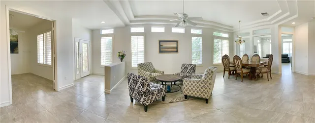 a dining room with furniture and wooden floor