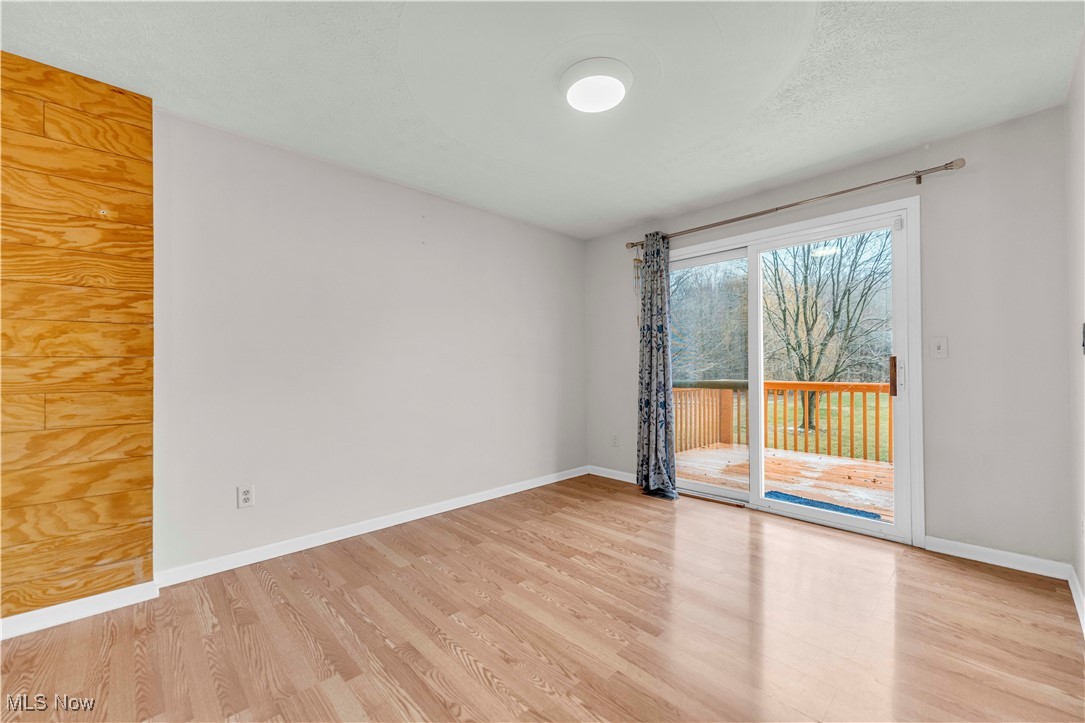 8110 Risden Road Vermilion, OH 44089 - Photo 5 of 48 Spare room featuring light wood-type flooring