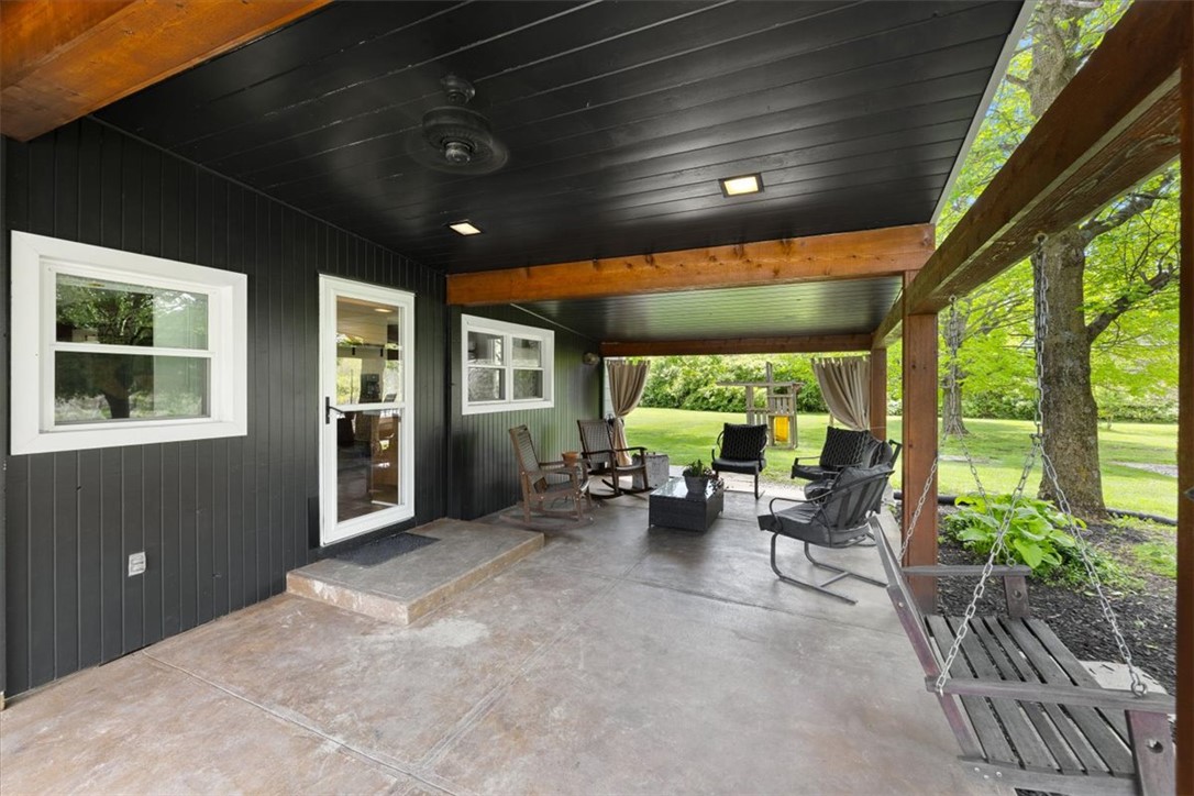 5120 Wheelock Road Troy, OH 45373 - Photo 39 of 67 Enjoy outdoor living on this expansive covered patio, perfect for relaxation and entertaining.