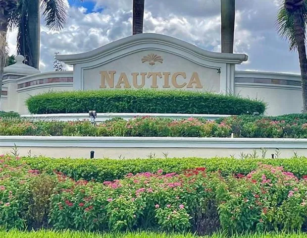 a view of a garden with a fountain in the background