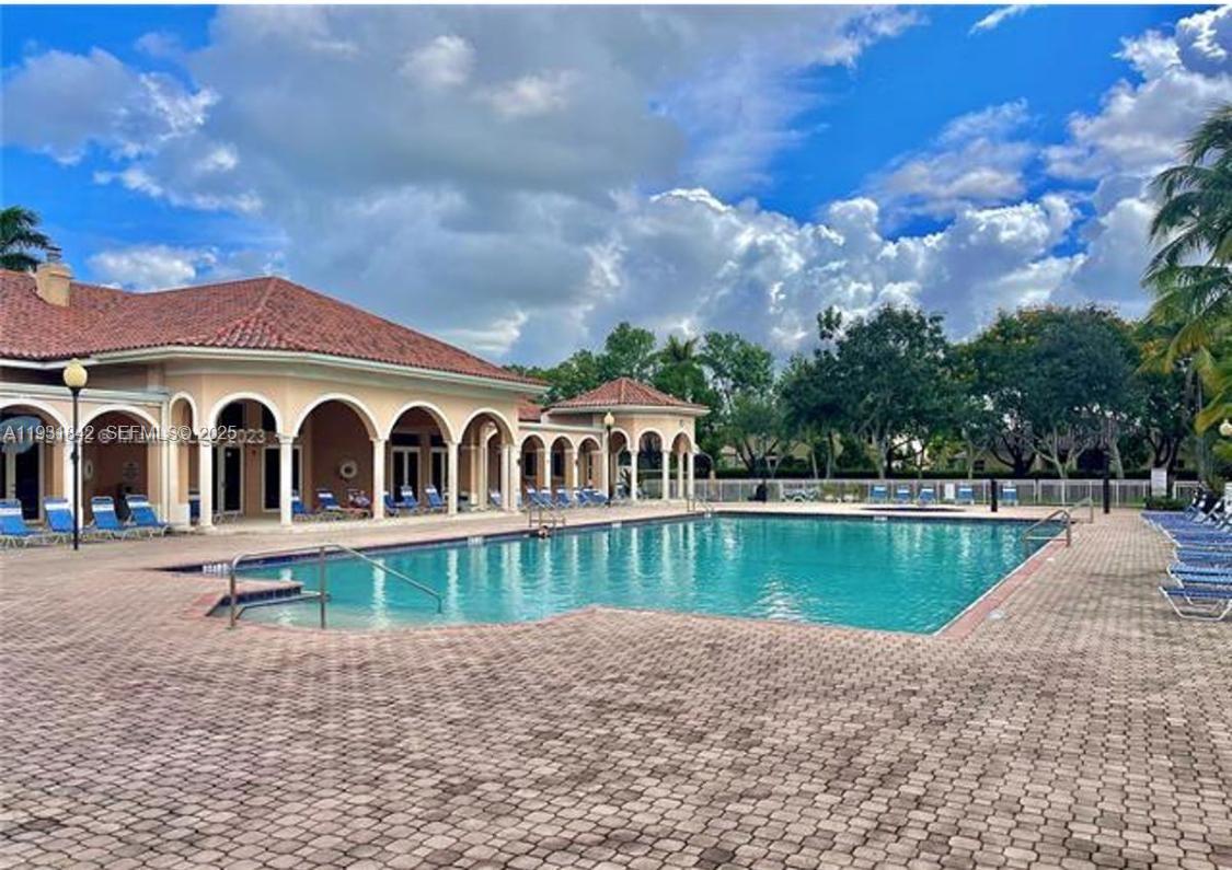 16972 Southwest 33rd Court, Unit 16972 Miramar, FL 33027 - Photo 6 of 15 a view of a house with a yard