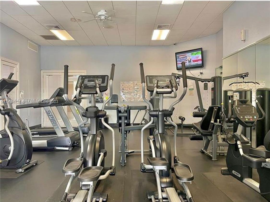 16972 Southwest 33rd Court, Unit 16972 Miramar, FL 33027 - Photo 8 of 15 a view of a room with gym equipment