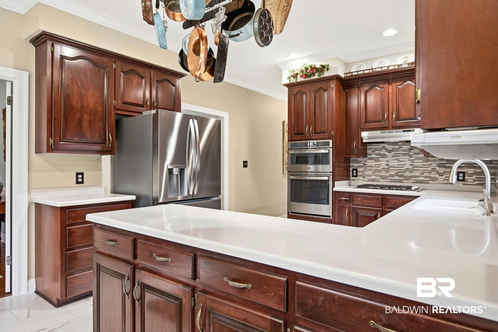31515 Rhett Drive Spanish Fort, AL 36527 - Photo 16 of 100 This beautiful kitchen has plenty of prep space, corian countertops, a gas cooktop and stainless steel appliances. (Fridge and DW are brand new). The prep space measures 12' x 10' 6" and the eating area has a bay window and measures 13' 6" x 11' 8".