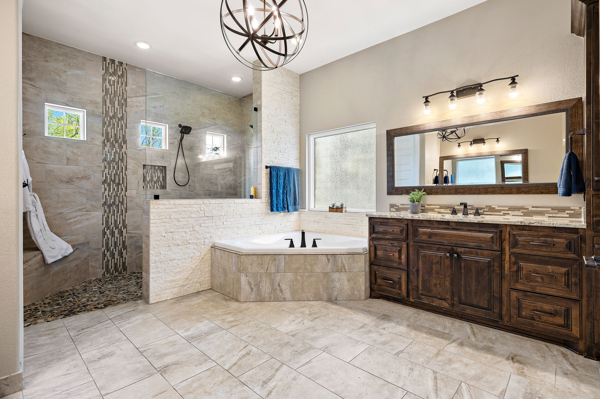 117 Covington Cove Georgetown, TX 78628 - Photo 16 of 40 Bathroom featuring a garden tub, walk in shower, vanity, recessed lighting, and a chandelier