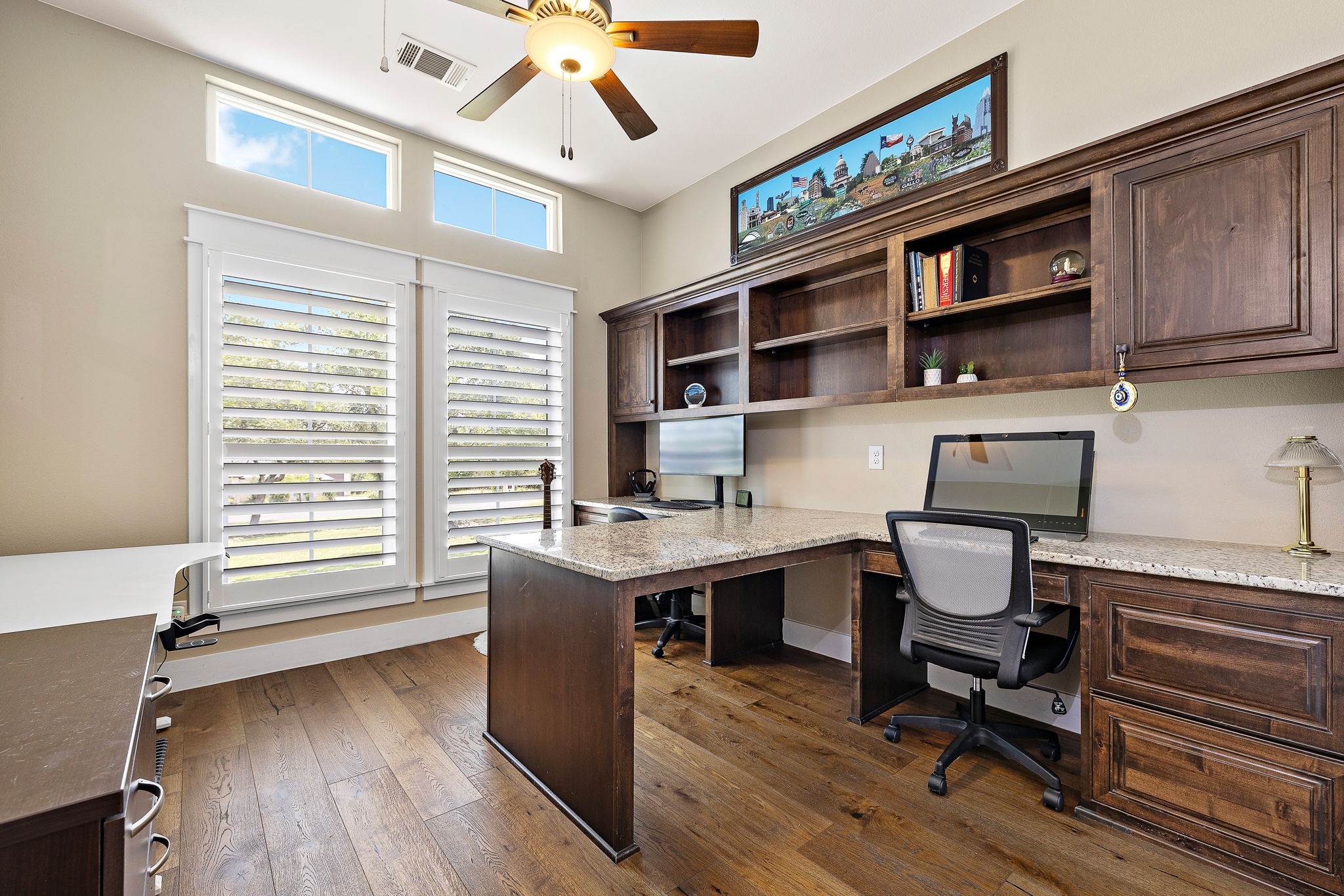 117 Covington Cove Georgetown, TX 78628 - Photo 19 of 40 Office with a ceiling fan, built in study area, and dark wood finished floors