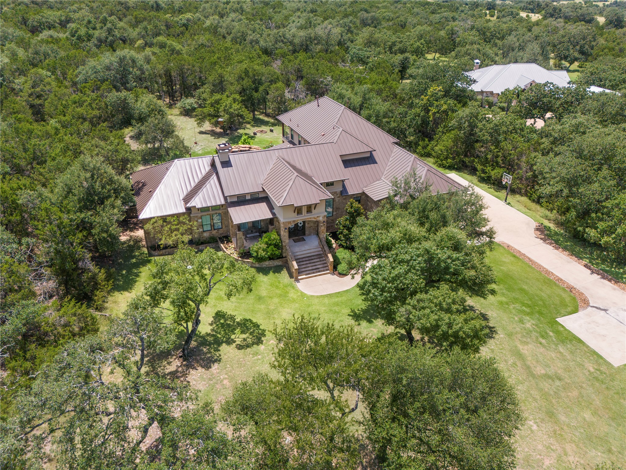 117 Covington Cove Georgetown, TX 78628 - Photo 2 of 40 View of subject property with a heavily wooded area