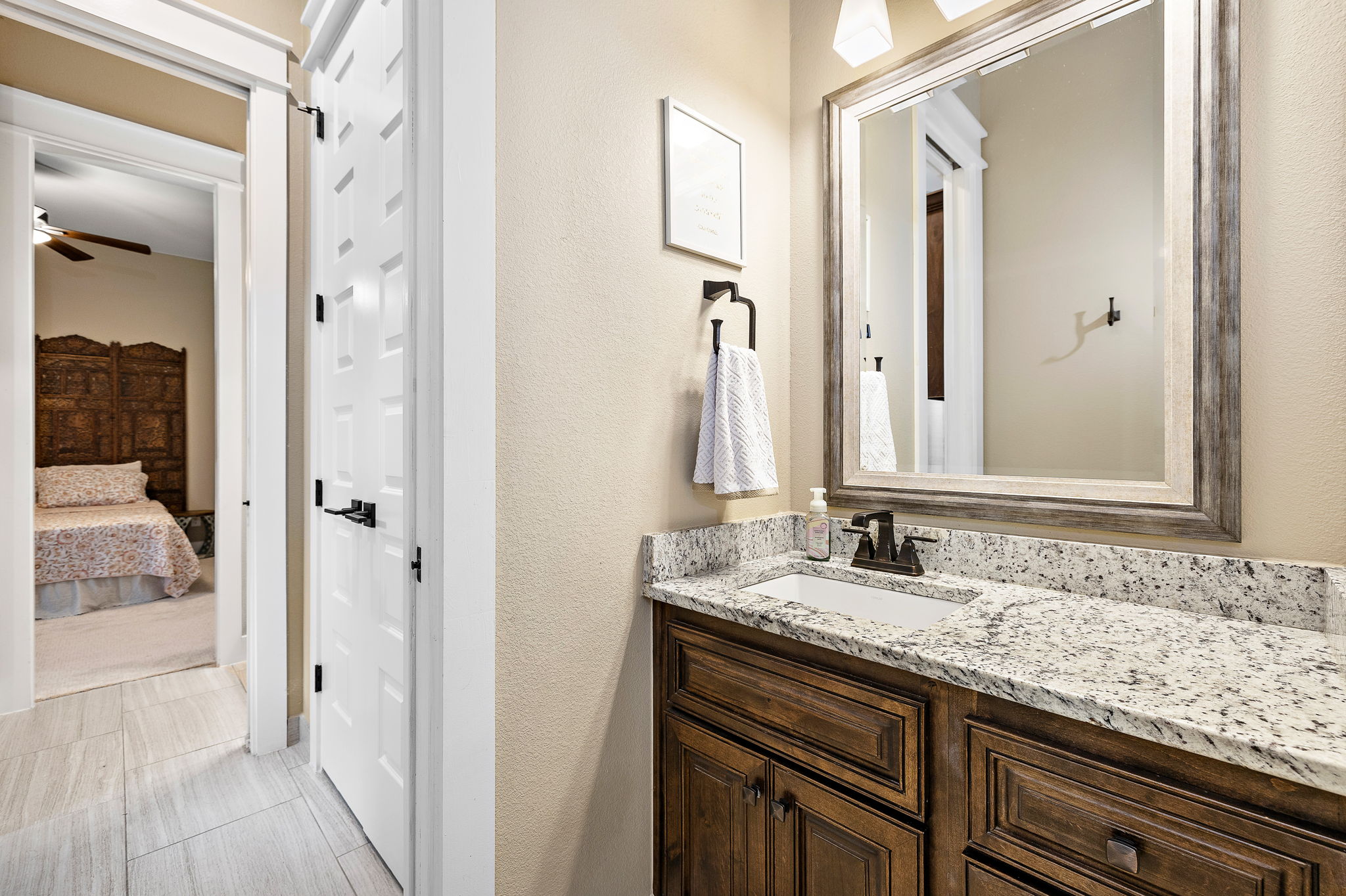 117 Covington Cove Georgetown, TX 78628 - Photo 21 of 40 Ensuite bathroom with vanity, ceiling fan, and a textured wall