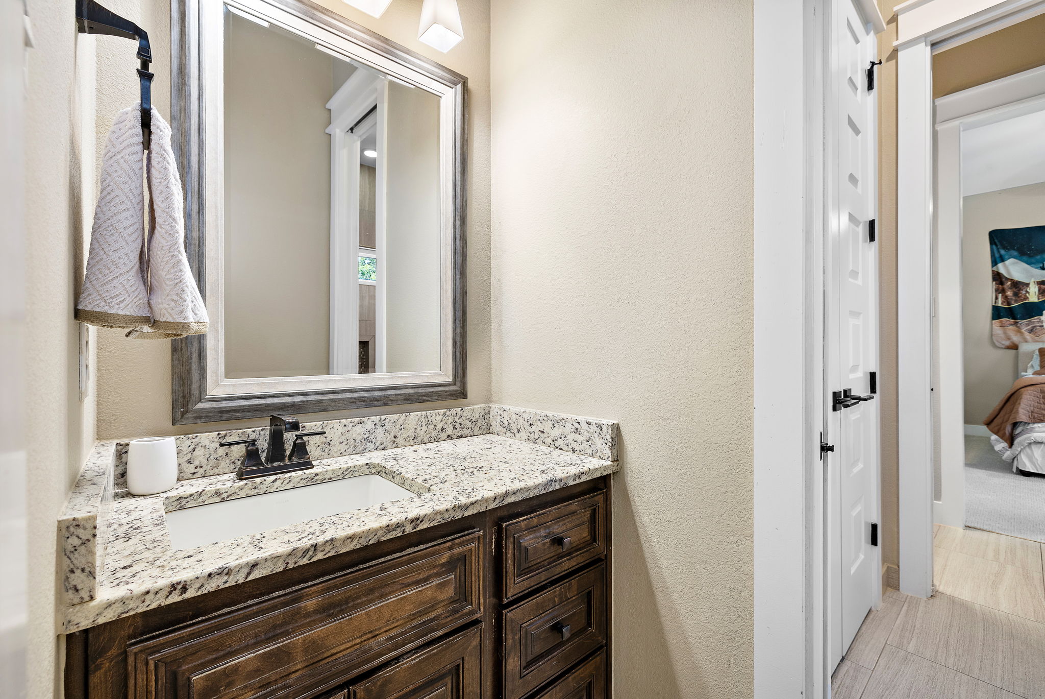 117 Covington Cove Georgetown, TX 78628 - Photo 23 of 40 Bathroom featuring vanity and a textured wall