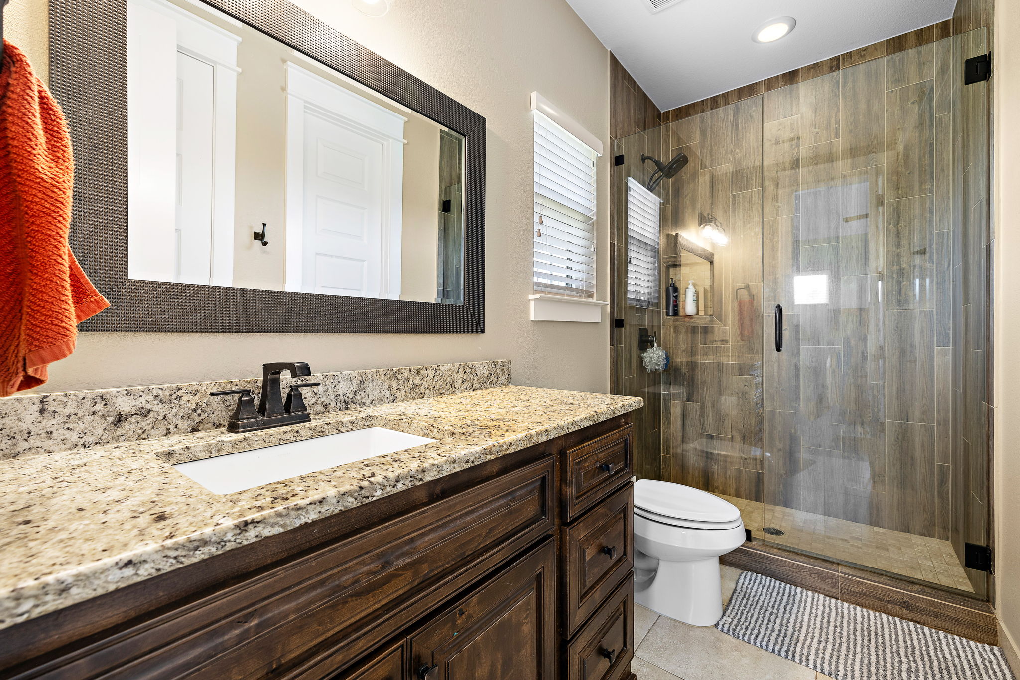 117 Covington Cove Georgetown, TX 78628 - Photo 28 of 40 Bathroom featuring vanity, a shower stall, and tile patterned flooring
