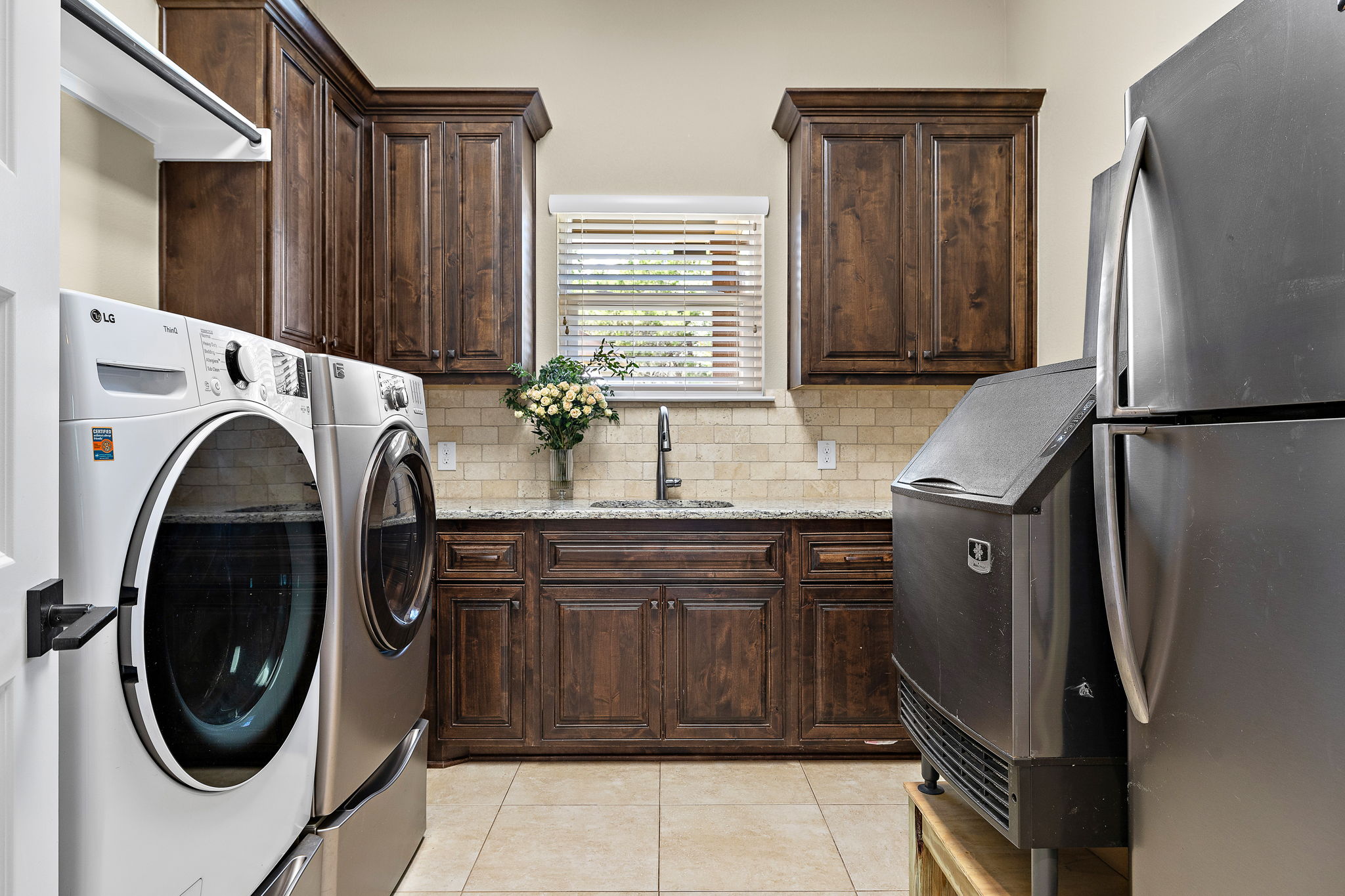 117 Covington Cove Georgetown, TX 78628 - Photo 32 of 40 Laundry area with separate washer and dryer, light tile patterned floors, and cabinet space