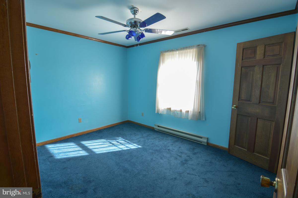 6930 Slaughter Beach Road Milford, DE 19963 - Photo 8 of 19 Master bedroom with attached bath.