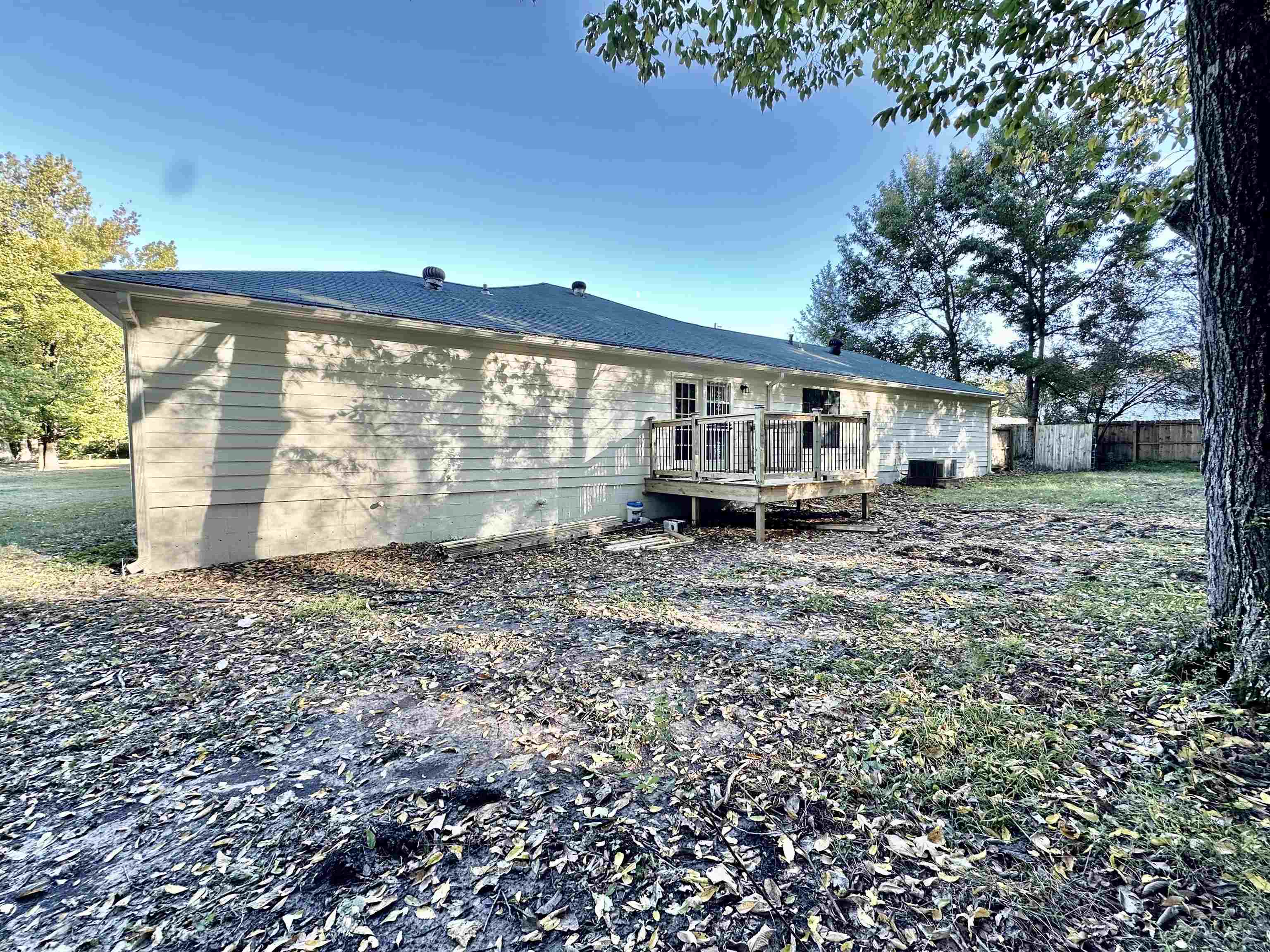 249 Mignon Road Atoka, TN 38004 - Photo 7 of 28 Rear view of property featuring a deck