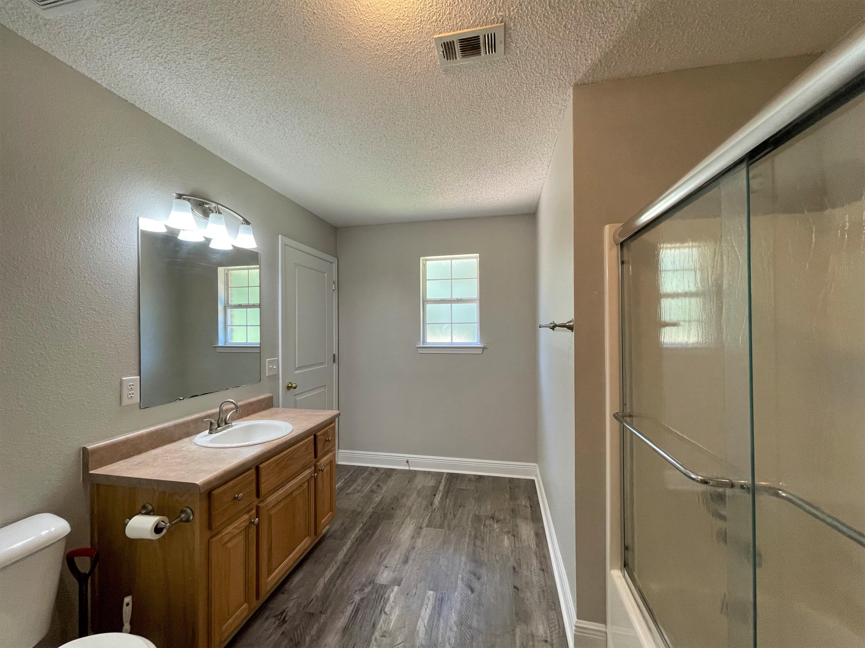 711 Fennec Fox Preserve Crestview, FL 32536 - Photo 24 of 33 a bathroom with a double vanity sink and a mirror