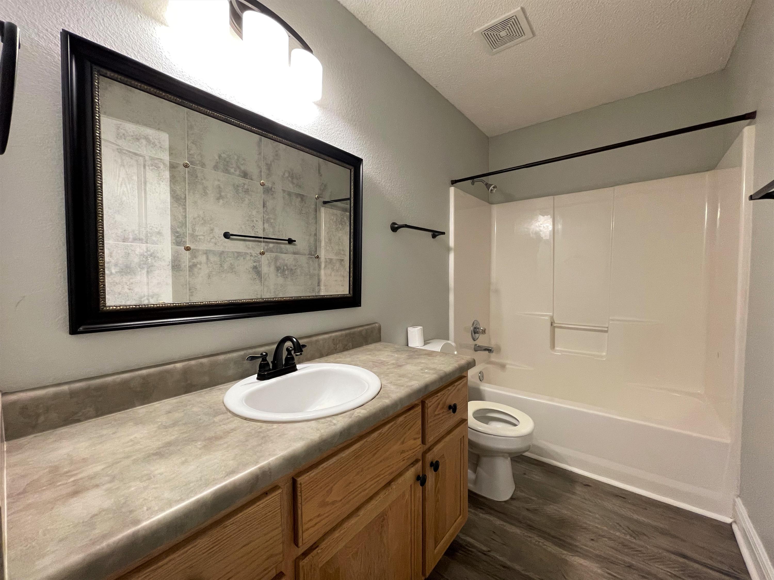 711 Fennec Fox Preserve Crestview, FL 32536 - Photo 26 of 33 a bathroom with a sink a toilet and shower