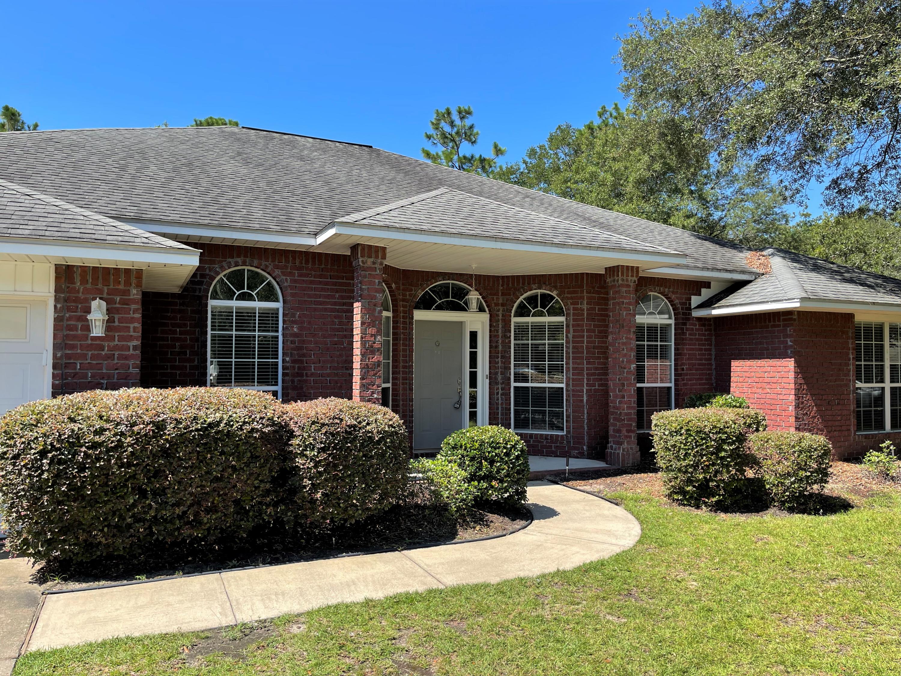 711 Fennec Fox Preserve Crestview, FL 32536 - Photo 32 of 33 a front view of a house with a yard