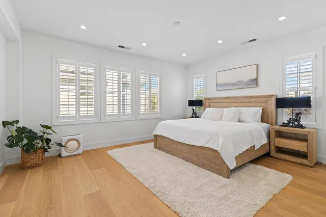 a bedroom with a large bed and a couch