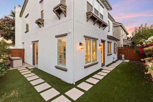 a view of front door and small yard
