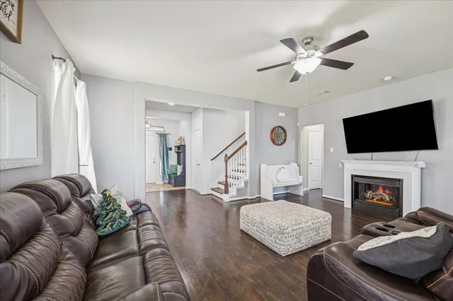 a living room with furniture fireplace and flat screen tv