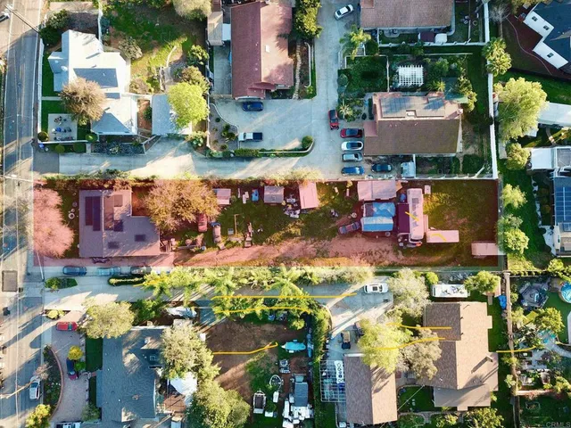 an aerial view of a houses with yard