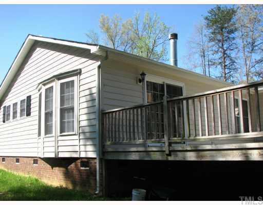 817 Red Mountain Road Rougemont, NC 27572 - Photo 3 of 12 Home has a nice large deck for entertaining. Exterior Back