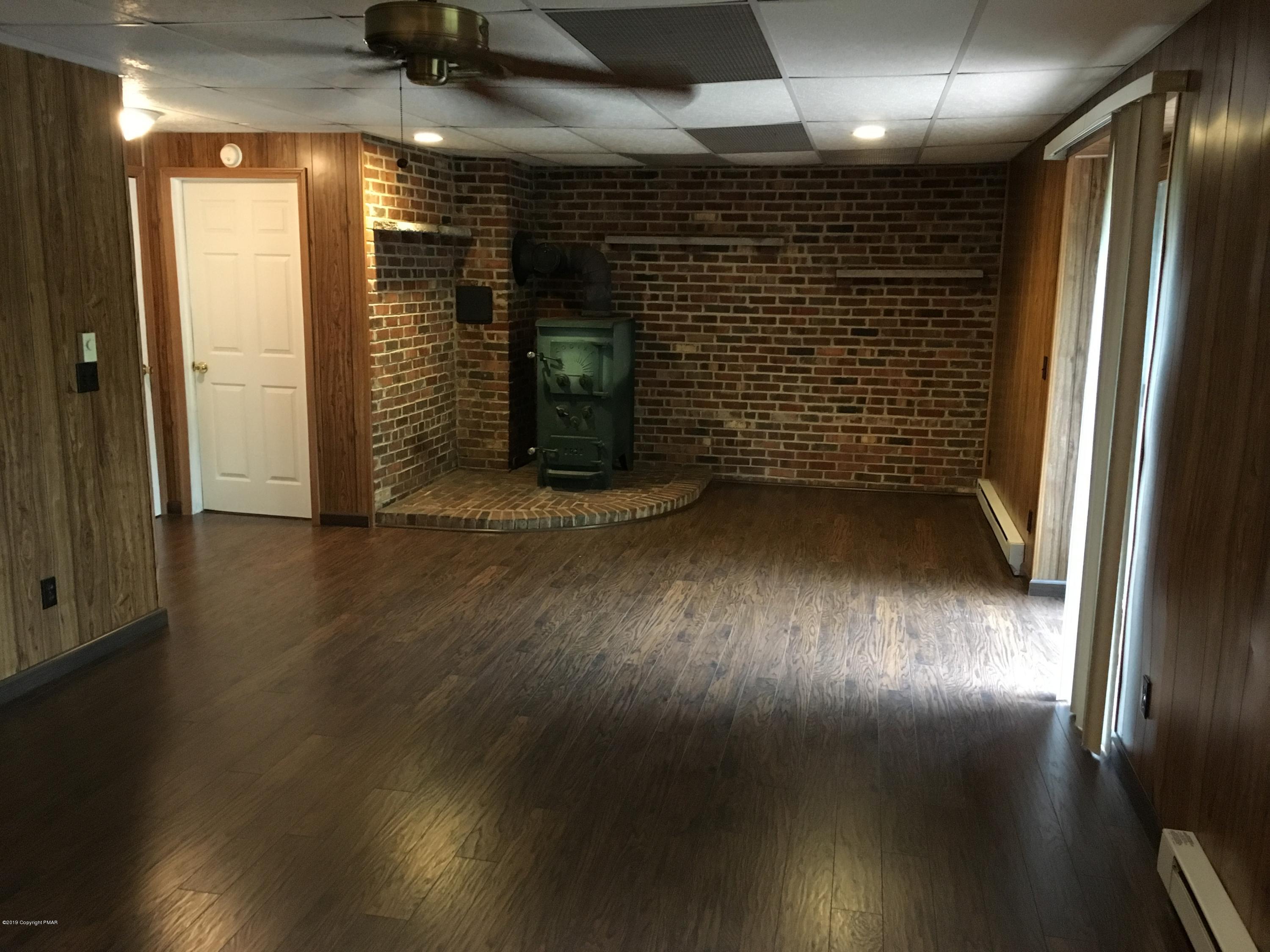 668 Cherry Lane Road East Stroudsburg, PA 18301 - Photo 11 of 28 a view of empty room with wooden floor