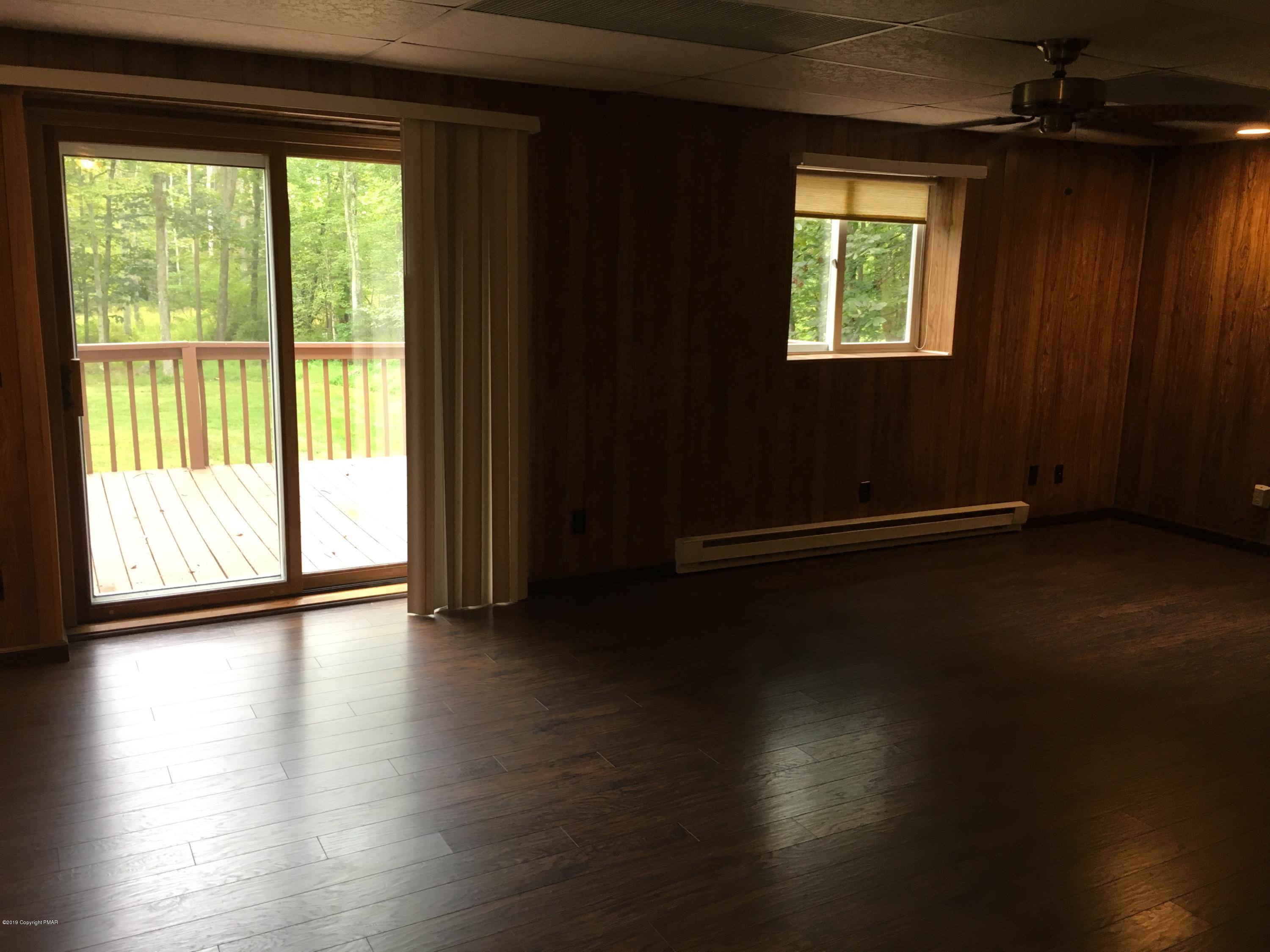 668 Cherry Lane Road East Stroudsburg, PA 18301 - Photo 13 of 28 a view of a room with wooden floor and a window