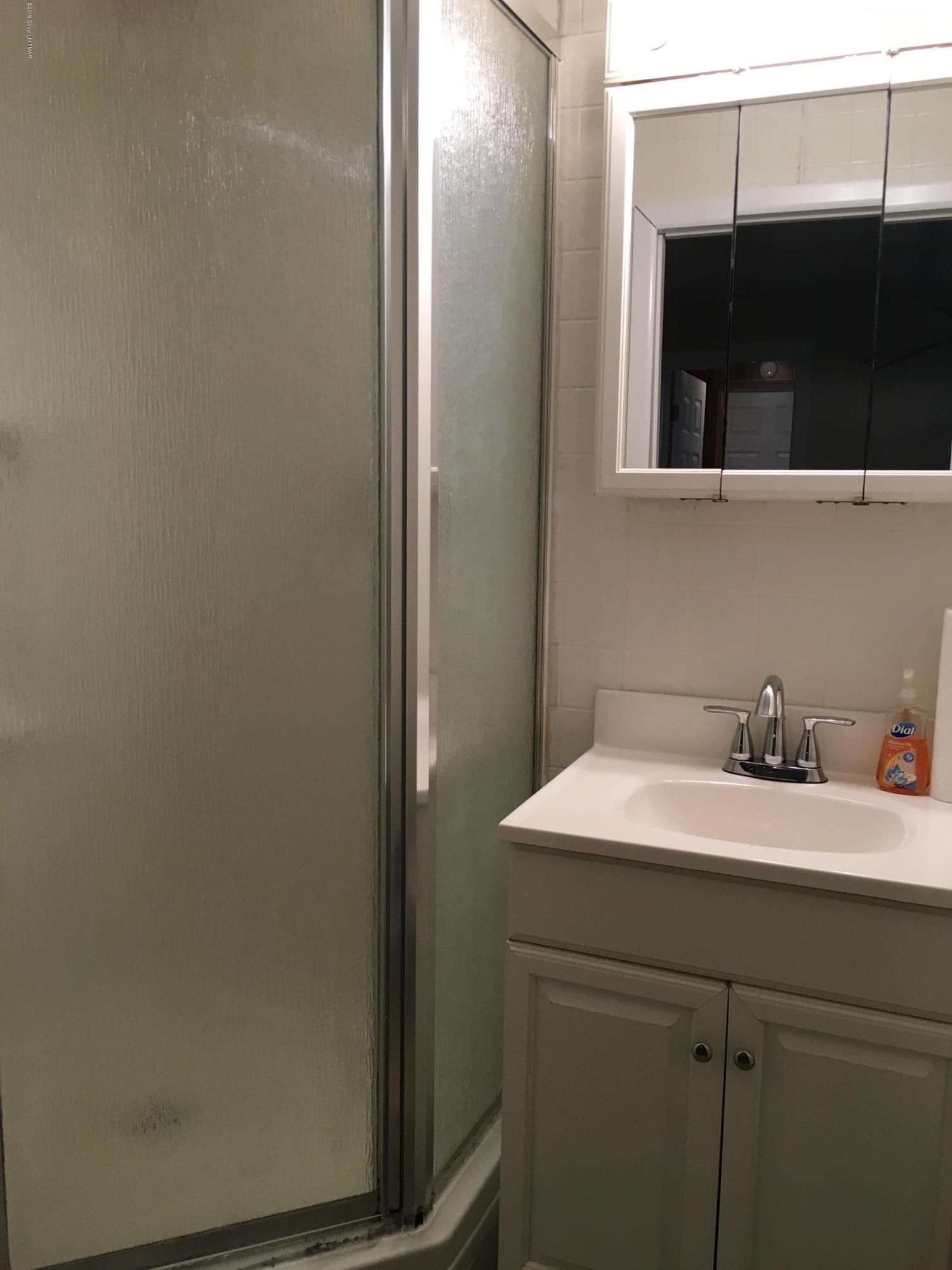 668 Cherry Lane Road East Stroudsburg, PA 18301 - Photo 14 of 28 a bathroom with a sink and a mirror