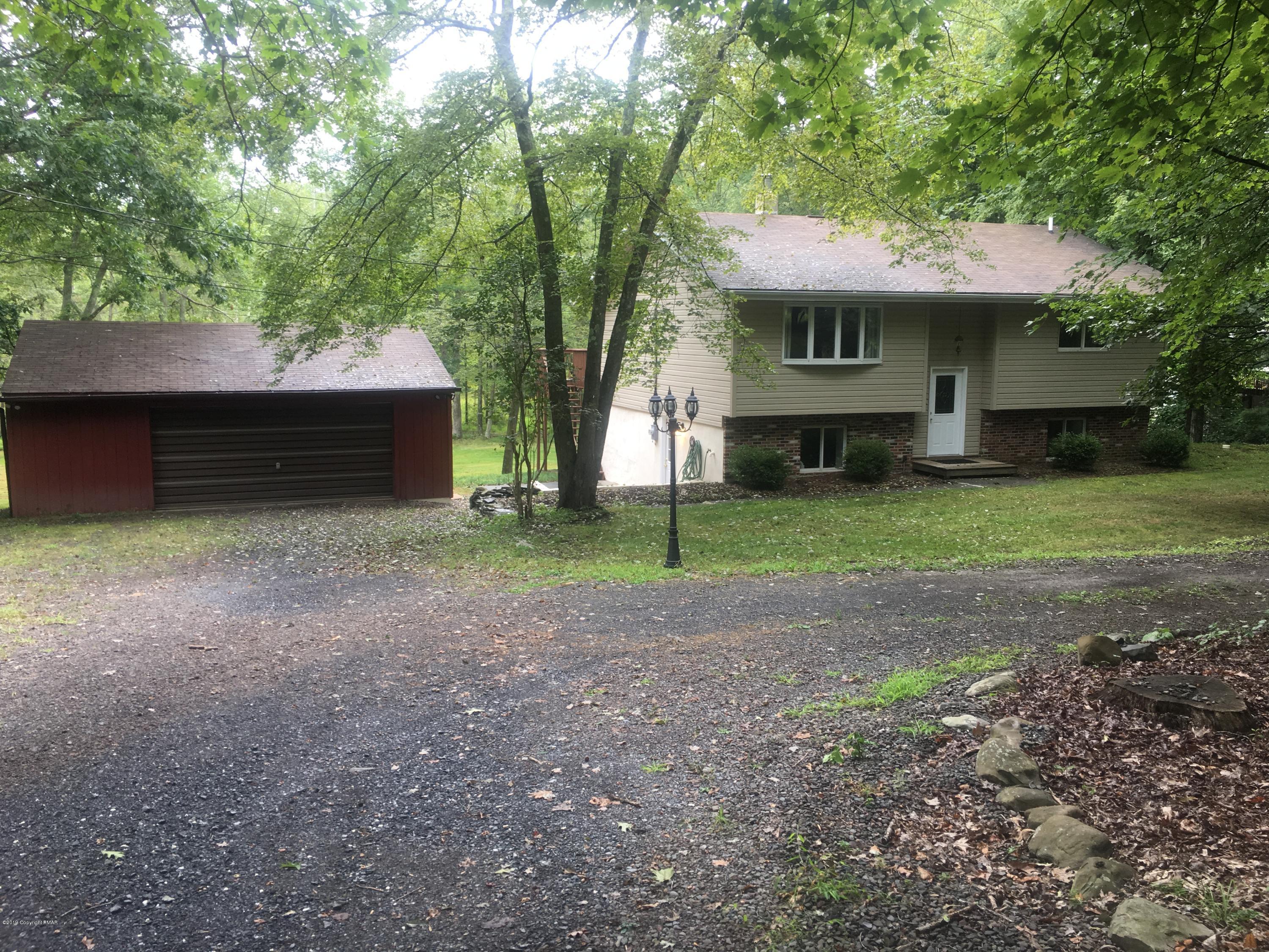 668 Cherry Lane Road East Stroudsburg, PA 18301 - Photo 2 of 28 a view of a house with a yard and tree
