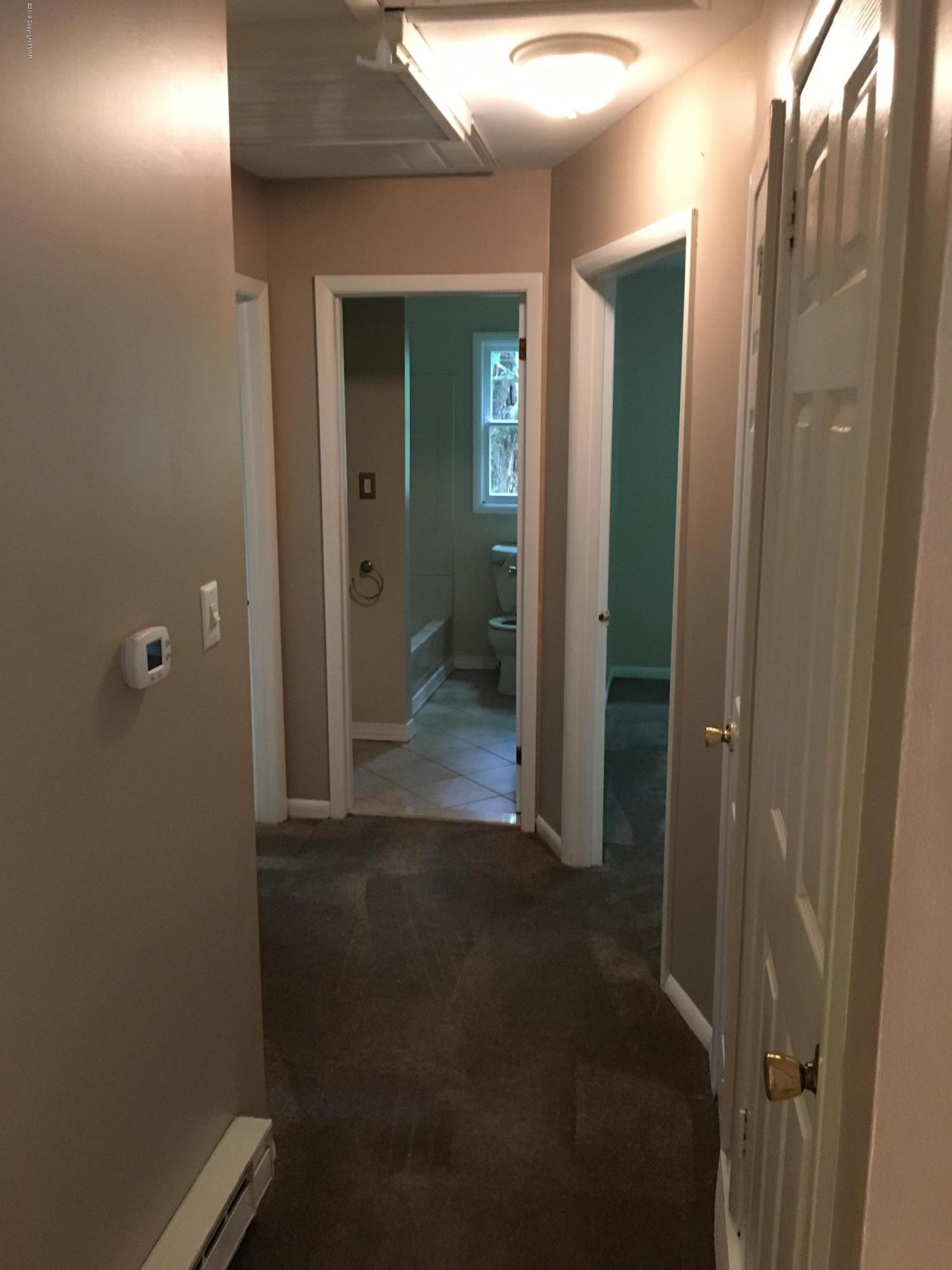 668 Cherry Lane Road East Stroudsburg, PA 18301 - Photo 22 of 28 a view of a bathroom from a hallway