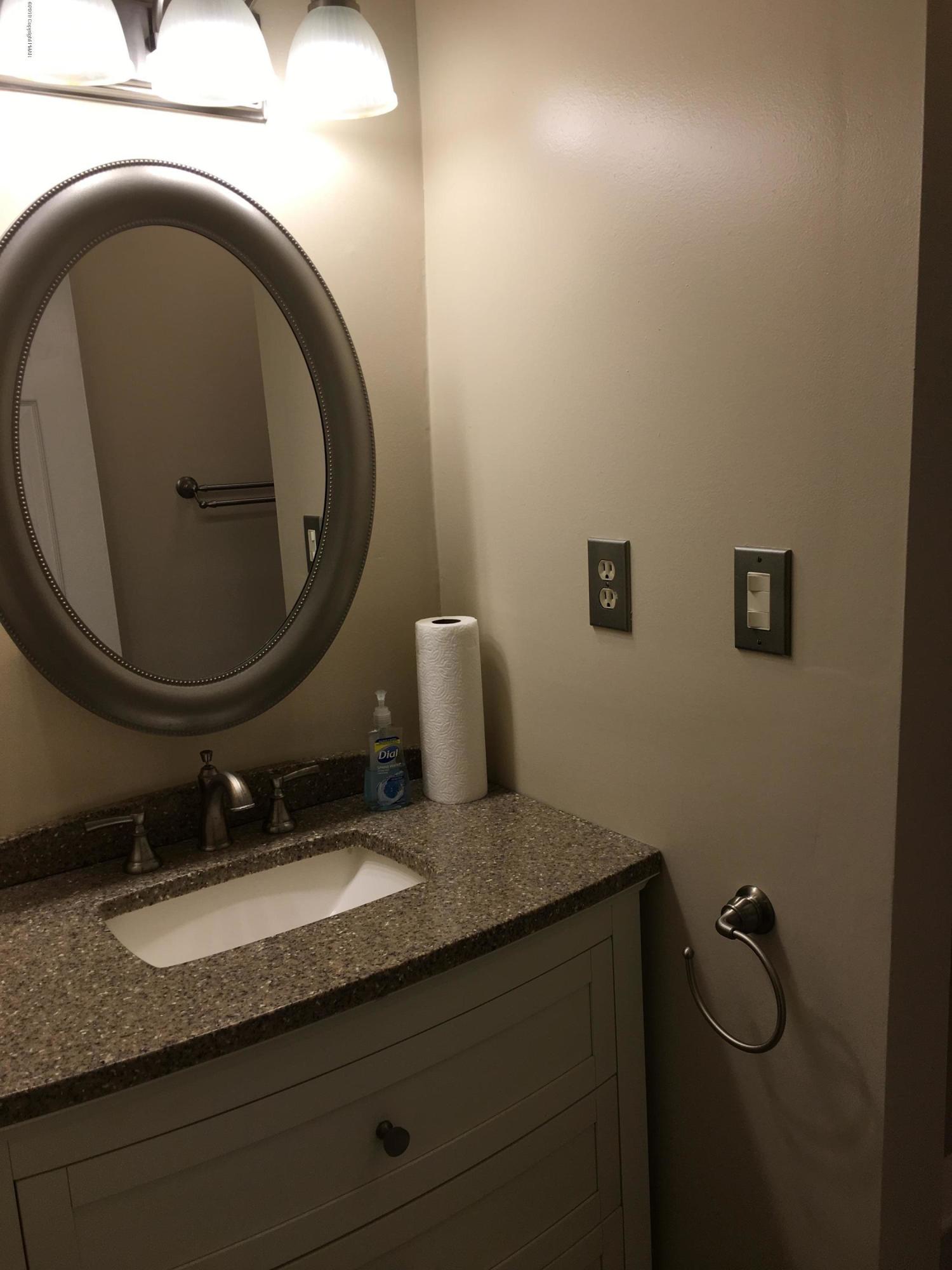 668 Cherry Lane Road East Stroudsburg, PA 18301 - Photo 25 of 28 a bathroom with a granite countertop sink and a mirror