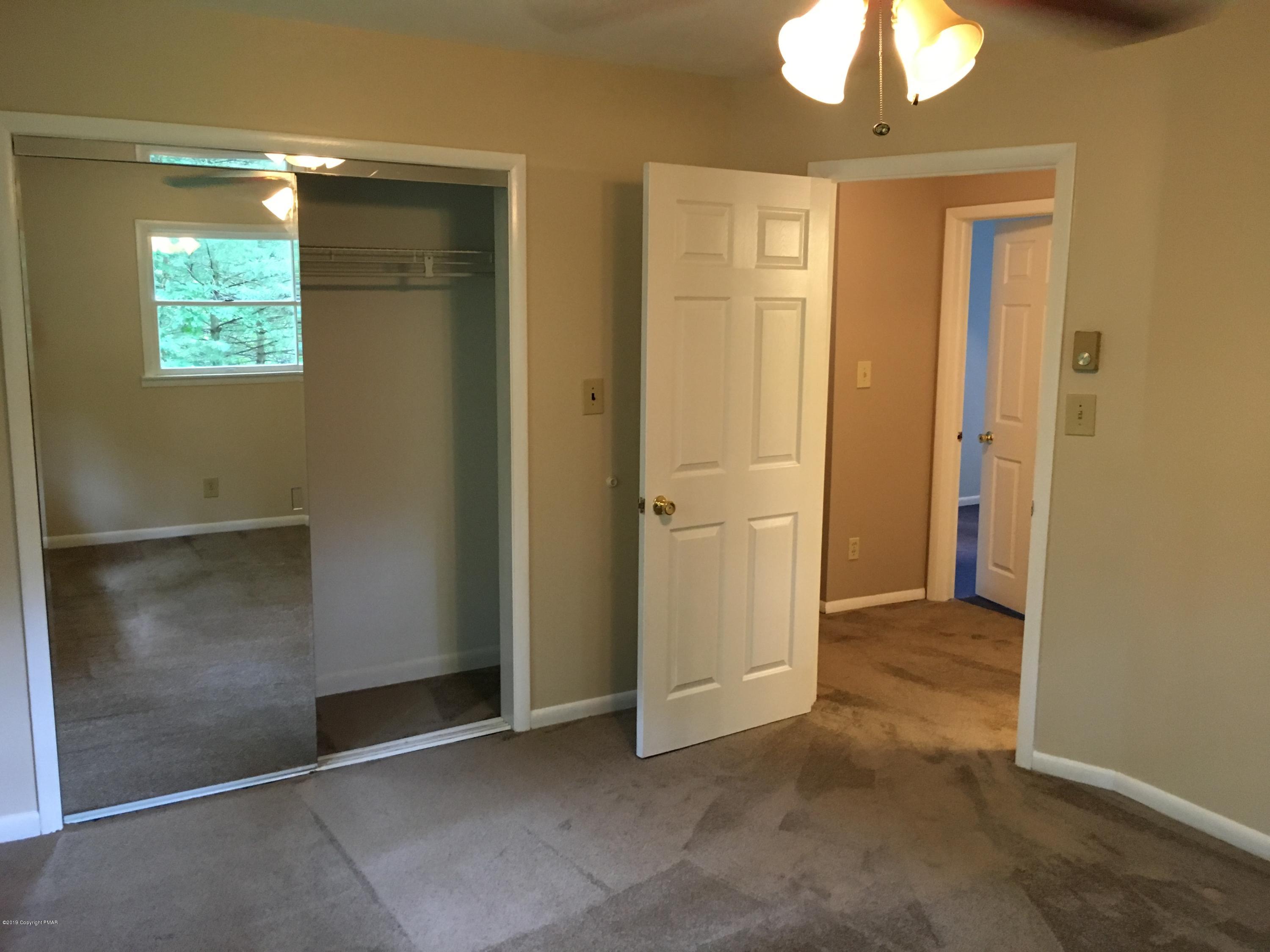 668 Cherry Lane Road East Stroudsburg, PA 18301 - Photo 28 of 28 an empty room with closet and windows