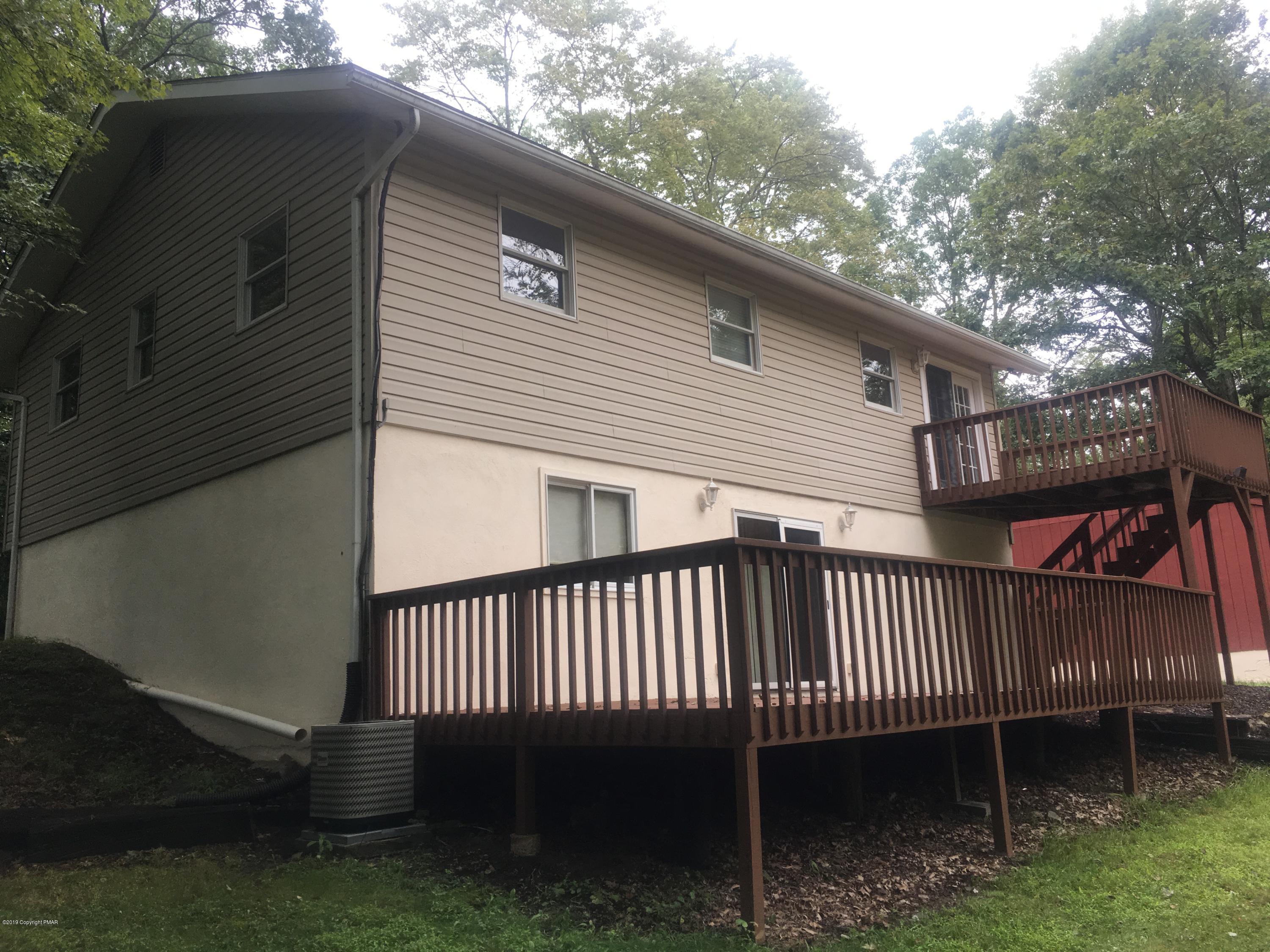 668 Cherry Lane Road East Stroudsburg, PA 18301 - Photo 5 of 28 a view of a roof deck with wooden fence and floor
