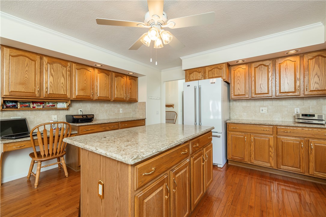 85 Sotheby Drive Greece, NY 14626 - Photo 19 of 50 BEAUTIFUL EAT-IN KITCHEN - WOOD CABINETRY & QUARTZ