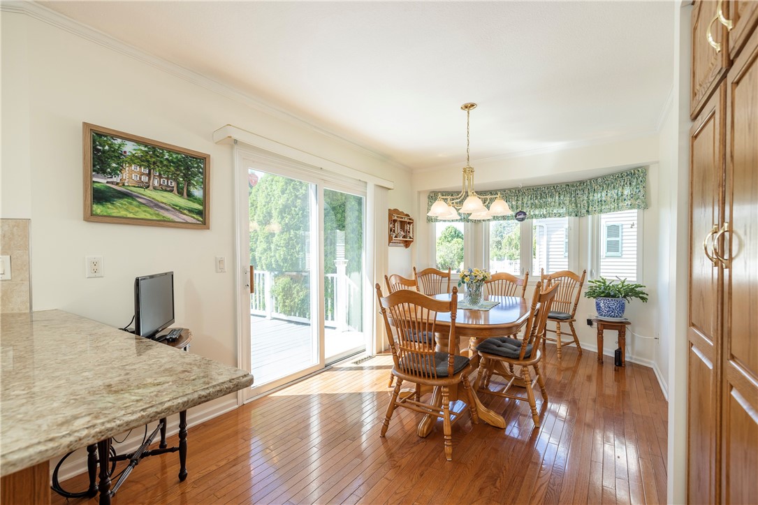 85 Sotheby Drive Greece, NY 14626 - Photo 22 of 50 DINING AREA OF KITCHEN WITH SLIDING GLASS DOOR & A
