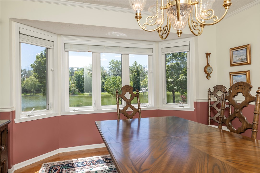 85 Sotheby Drive Greece, NY 14626 - Photo 28 of 50 FORMAL DINING ROOM WITH BOW WINDOWS & POND VIEWS