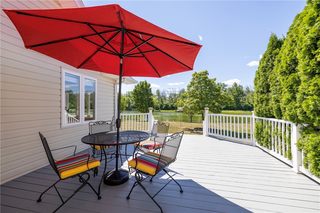 85 Sotheby Drive Greece, NY 14626 - Photo 7 of 50 ENTERTAINMENT SIZED DECK LEADING TO BACKYARD & PON
