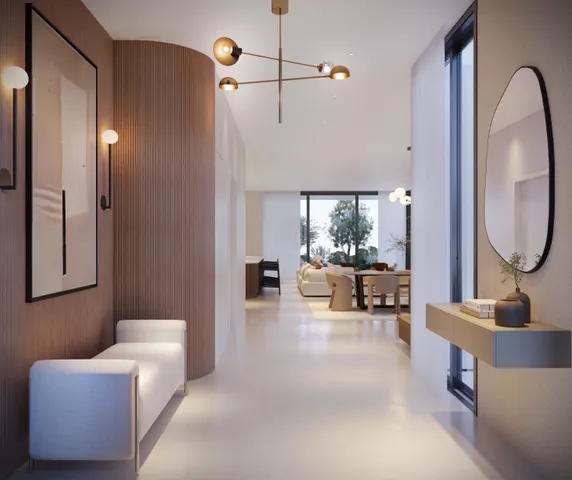 a living room with furniture and a mirror