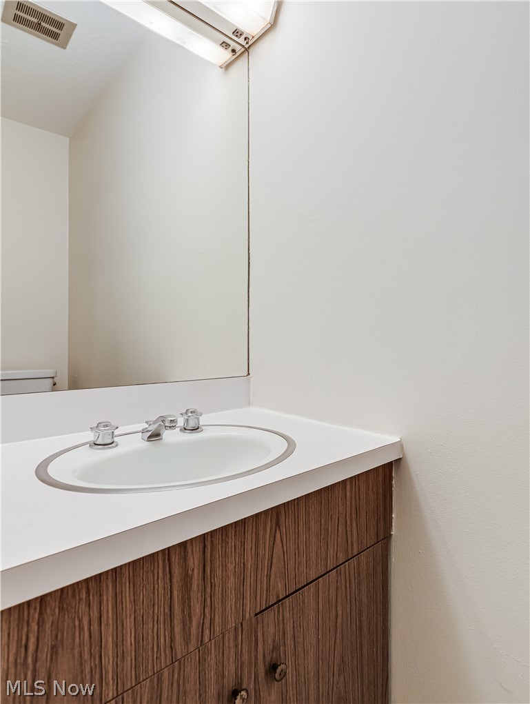 2550 Chamberlain Road, Unit A3 Akron, OH 44333 - Photo 14 of 21 Bathroom with toilet and vanity with extensive cabinet space