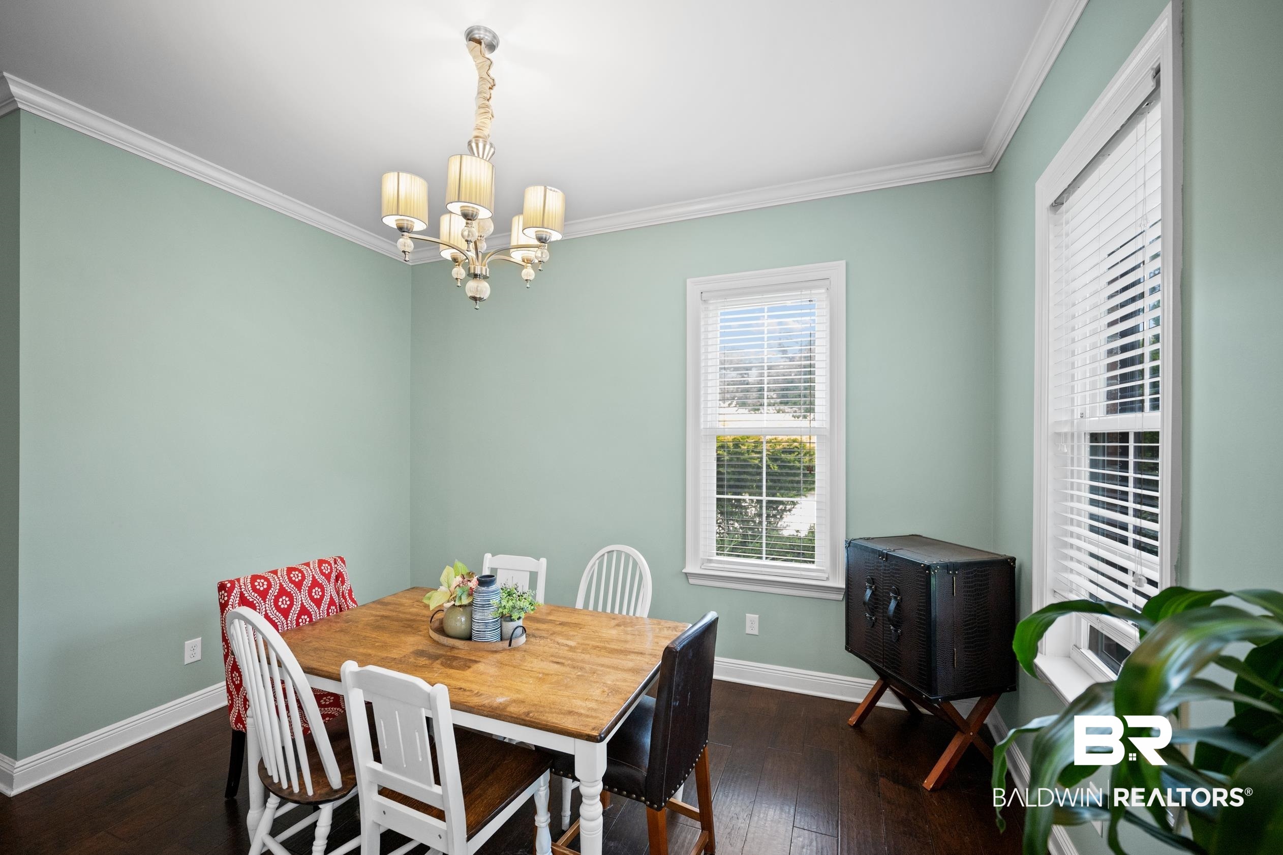 9060 Bromley Road Bay Minette, AL 36507 - Photo 13 of 63 Dining room with a chandelier, ornamental molding, and dark wood finished floors