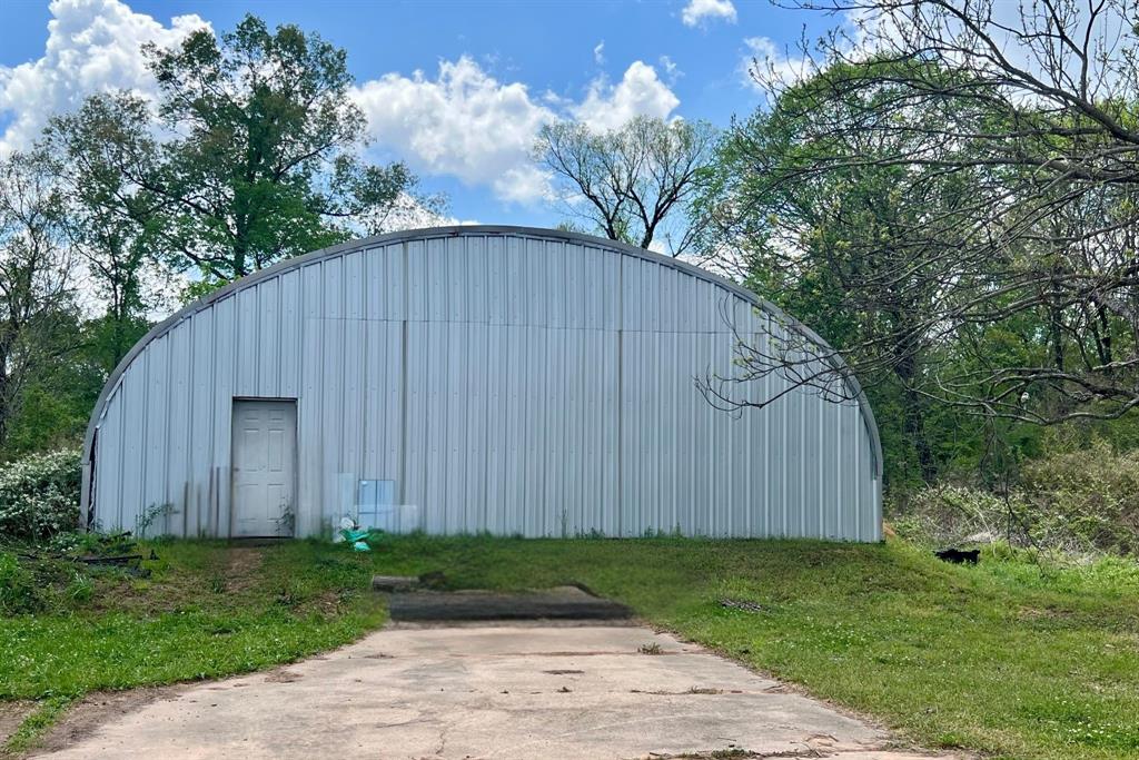 401 Cane Bend Drive Haughton, LA 71037 - Photo 11 of 12 a backyard of a house with lots of green space