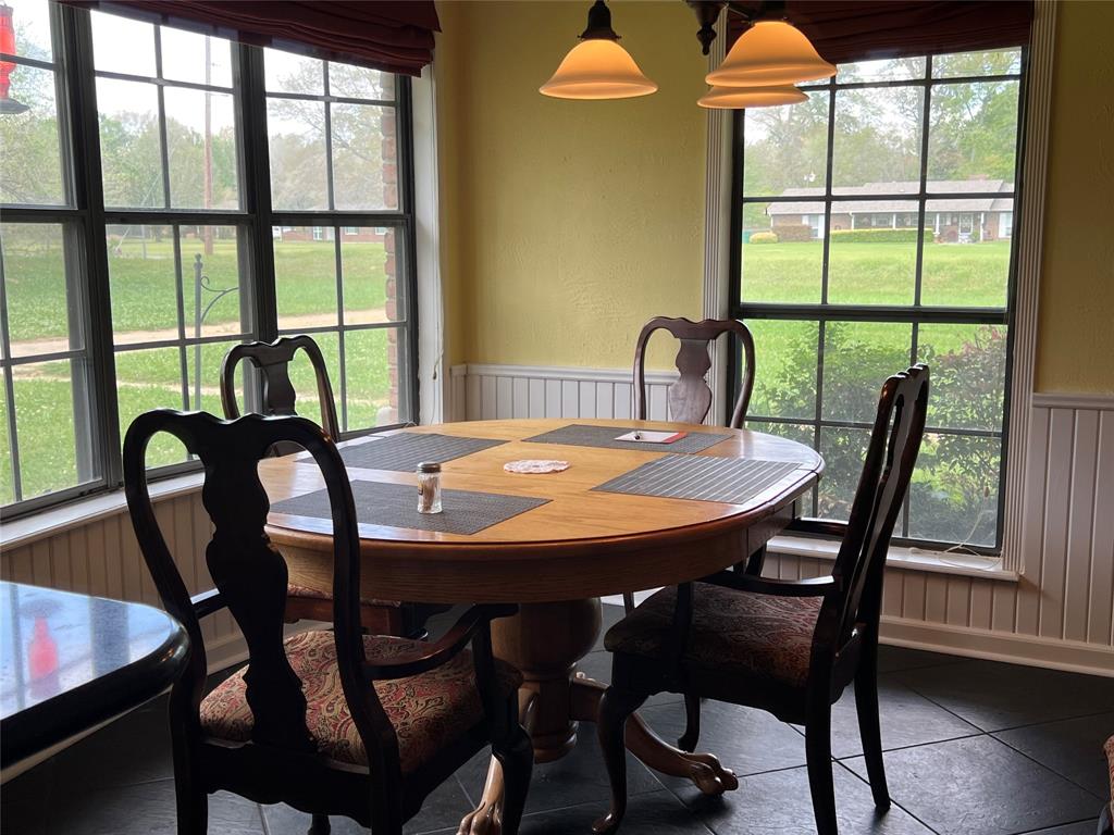401 Cane Bend Drive Haughton, LA 71037 - Photo 6 of 12 a view of a dining room with furniture window and wooden floor
