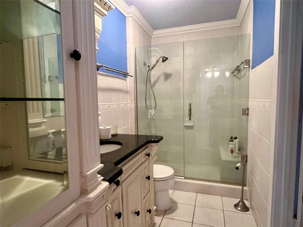 401 Cane Bend Drive Haughton, LA 71037 - Photo 7 of 12 a bathroom with a granite countertop bathtub shower sink and toilet