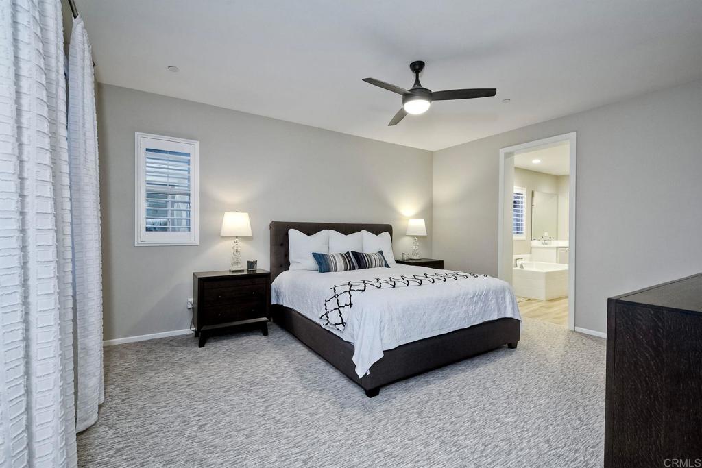 663 Gemstone Drive San Marcos, CA 92078 - Photo 19 of 38 a bed sitting in a bedroom next to a window