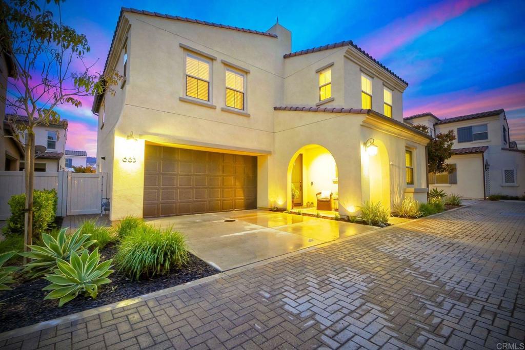 663 Gemstone Drive San Marcos, CA 92078 - Photo 2 of 38 a view of a brick house with a swimming pool