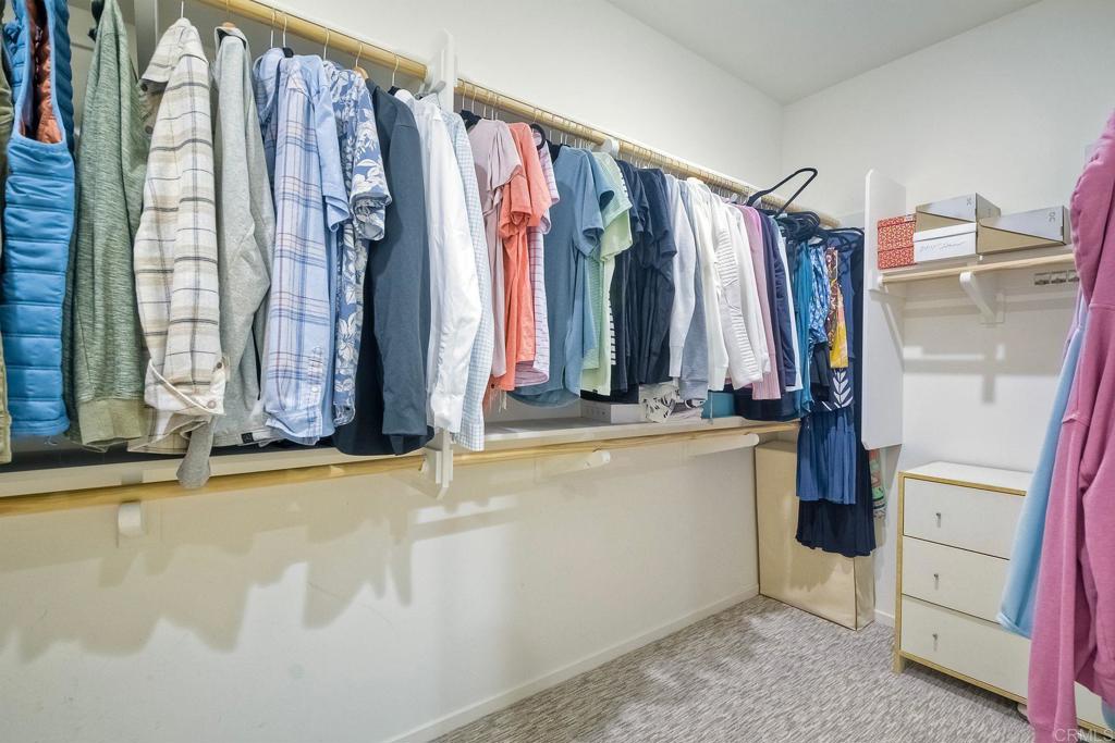 663 Gemstone Drive San Marcos, CA 92078 - Photo 22 of 38 a view of walk in closet with clothes and shoes