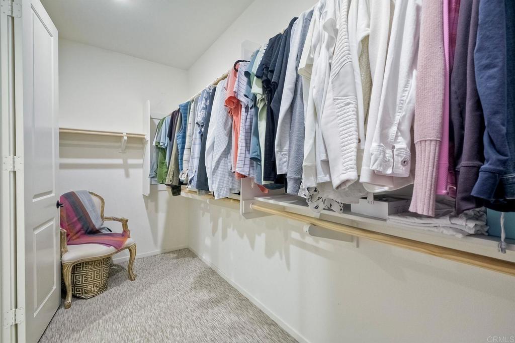 663 Gemstone Drive San Marcos, CA 92078 - Photo 23 of 38 a view of walk in closet with clothes and shoes