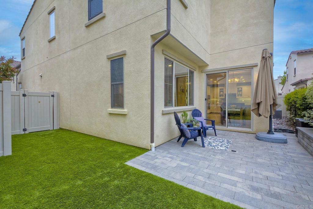 663 Gemstone Drive San Marcos, CA 92078 - Photo 28 of 38 a view of a patio with a table and chairs