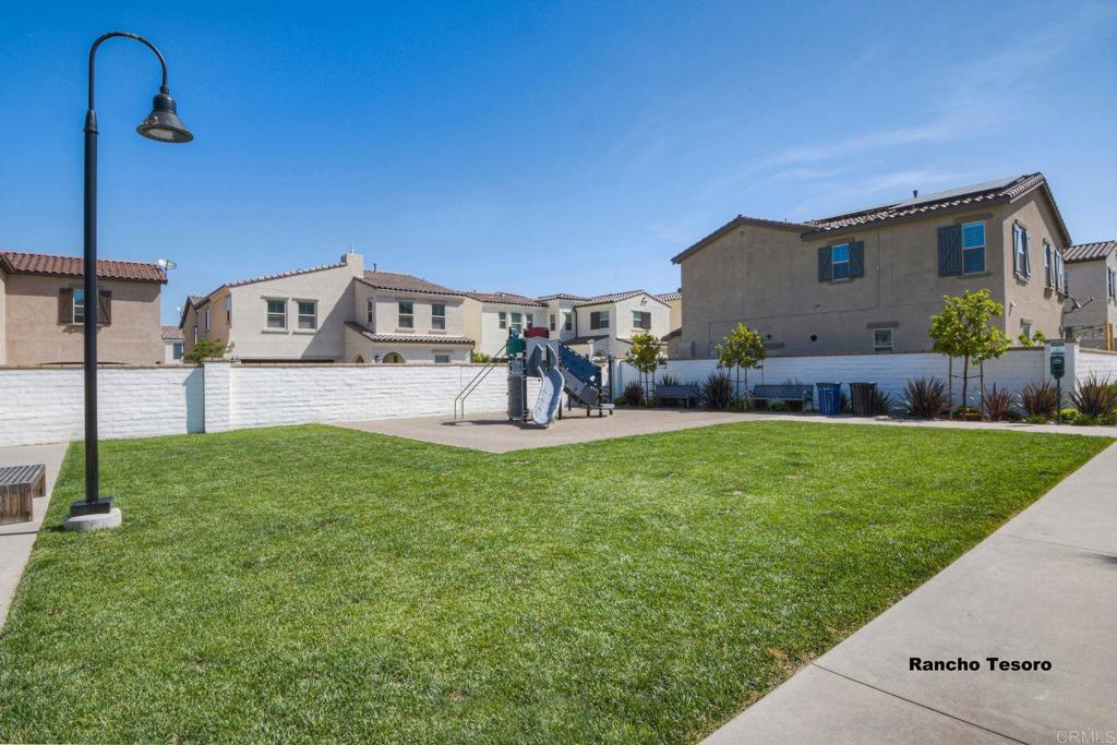 663 Gemstone Drive San Marcos, CA 92078 - Photo 34 of 38 a front view of a house with garden
