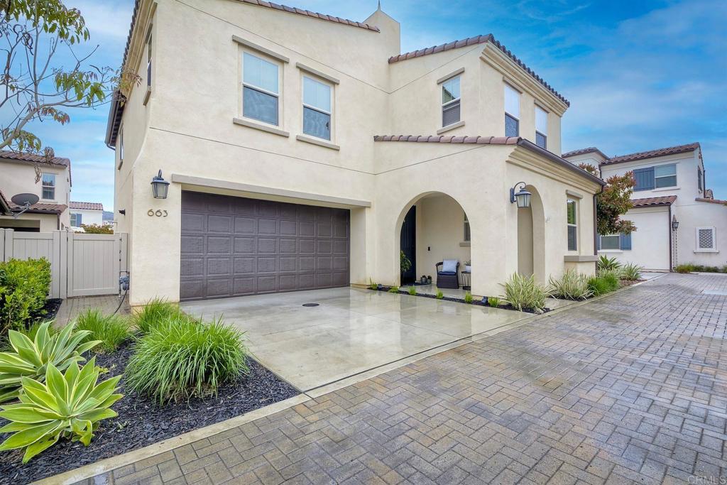 663 Gemstone Drive San Marcos, CA 92078 - Photo 6 of 38 a front view of a house with garden